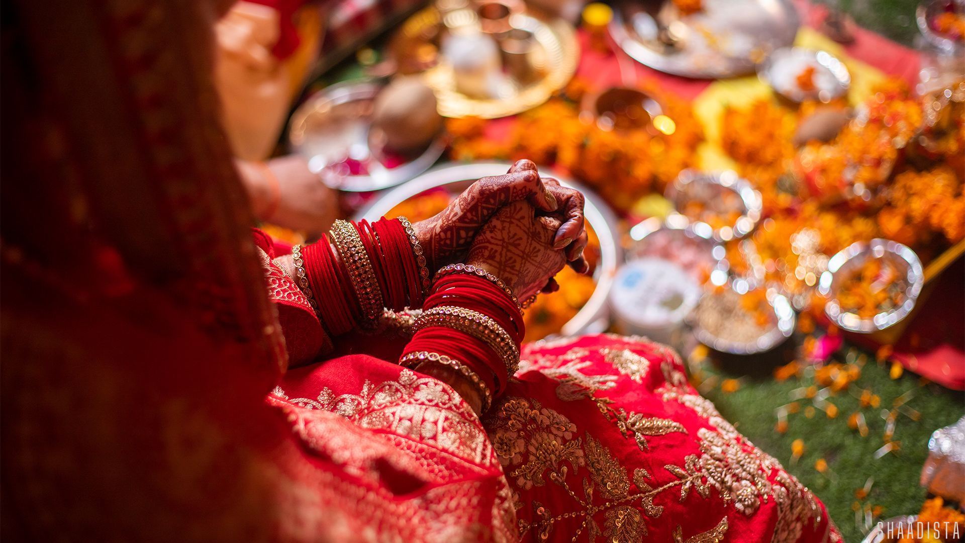 Bride with floral wedding decor – candid wedding photography Delhi Shaadista