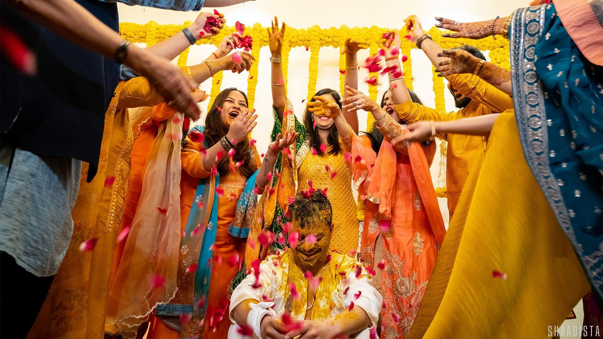 Bride dancing in yellow lehenga Haldi ceremony – candid wedding photography Shaadista