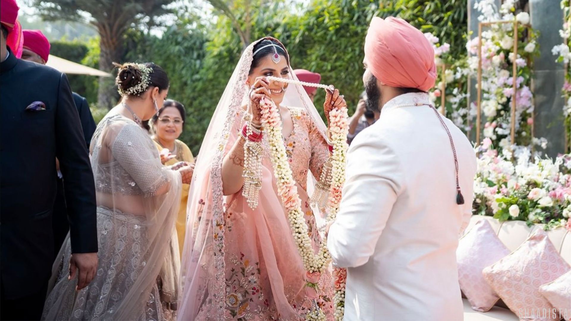 Bride in pink lehenga with groom wedding procession – Shaadista Delhi